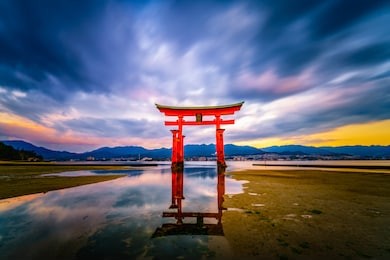 floating torii gate of itsukushima shrine at miyajima, hiroshima, japan (gate sign reads itsukushima shrine)