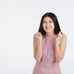 beautiful young asian woman in pink dress, feeling very happy amazed excited surprised, portrait short isolated on white background.