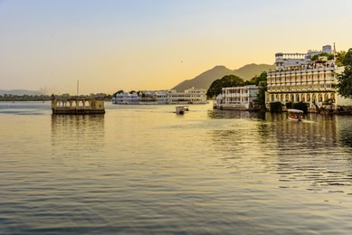 panoramic view of city of lakes udaipur with lake pichola from ambrai ghat,rajasthan, india.