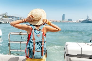 happy tourist woman traveler standing on cruise ship or ferry boat