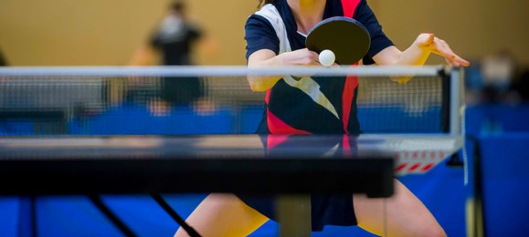 close up of a table tennis player returning