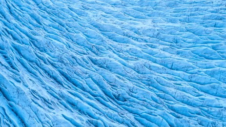 beautiful glaciers flow through the mountains in iceland. aerial view and top view.