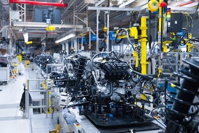 automotive mechanical assembly, engine, transmission, suspension and breaking system. automotive engine assembly line is in production. car assembly by parts