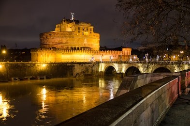 tiber river, angel bridge (ponte sant'angelo) and angel castle (castel sant'angelo) at night. italy.