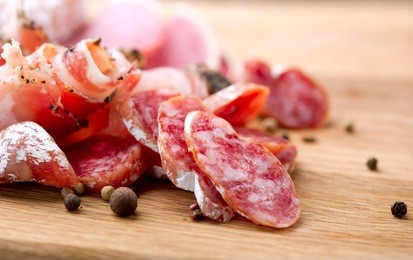 sausage. dried smoked sausages sliced on board