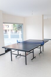 ping pong tennis table in empty room.