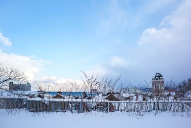 hokkaido, japan - december 15, 2018 : otaru snowy city landscape nearby otaru music box museum.