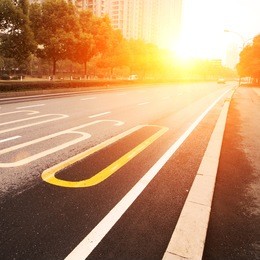 road in city with sunset