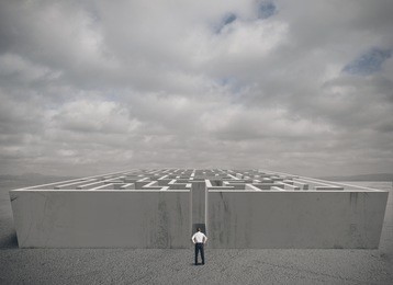 businessman and maze challenge concept