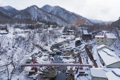 jozankei onsen is located inside shikotsu-toya national park between the high cliffs of the toyohira river. the town is only one hour outside central sapporo, making it a popular side trip.