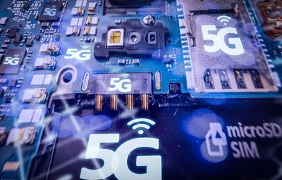 disassembled mobile phone or smartphone without a back cover, and 5g or lte word printed in circuit board, microcircuit, slots for sim cards.high speed mobile web technology concept. macro shot