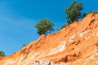 fairy stream canyon, the muddy waters of the fairy river (suoi tien) with red river, tropical oasis scenery of hills with limestone, sandstone plateaux. popular and famous landmark of mui ne, vietnam