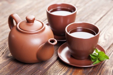 tea with mint on a wooden table - studio still life
