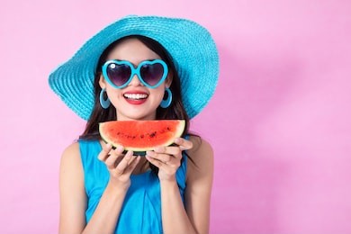 asian woman smiling with watermelon