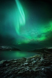 the northern lights (aurora borealis) as seen from northern norway. contains noise.