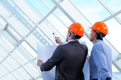 two men in hard hats at construction site