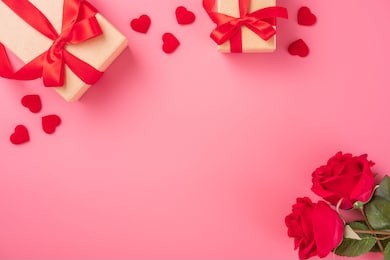 kraft gift box with beautiful red ribbon and rose, concept of valentine's, anniversary, mother's day and birthday greeting, copyspace, topview.