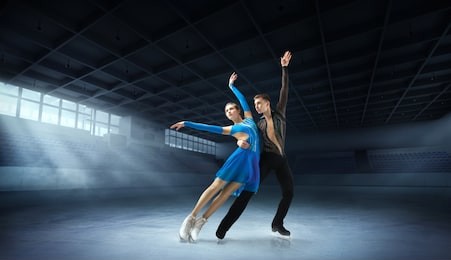 figure skating pair in ice arena