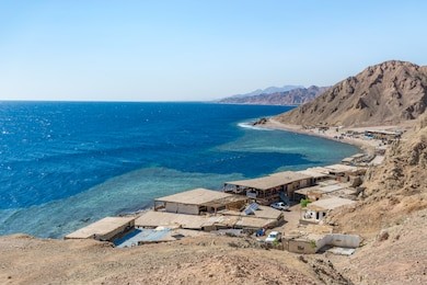 blue hole is a popular diving location on east sinai, a few kilometres north of dahab, egypt on the coast of the red sea.