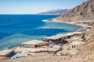 blue hole is a popular diving location on east sinai, a few kilometres north of dahab, egypt on the coast of the red sea.