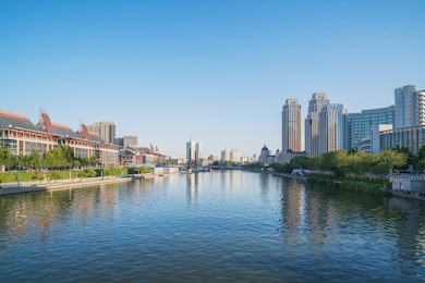 view of river and modern urban architecture skyline panorama in tianjin china