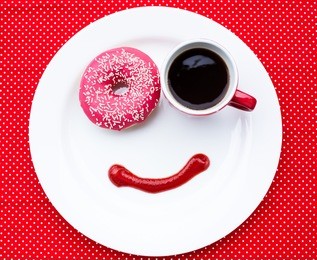 coffee and donut at a dish with smile
