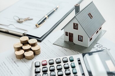 house model with real estate agent and customer discussing for contract to buy house, insurance or loan real estate background.