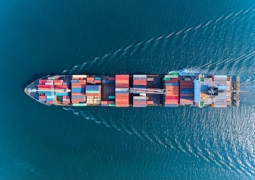 aerial top view container ship with crane bridge for load container, logistics import export, shipping or transportation concept background.