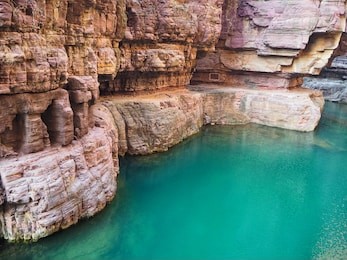 hongshi valley with red sandstone quartz cliff, miniature gorge and water at the mount yuntaishan, the unesco global geopark in jiaozuo, china.