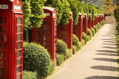 decorative english phone booths in nong nooch tropical park, pattaya thailand