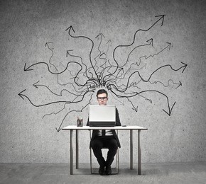 young businessman working at desk with laptop
