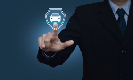businessman pressing car with shield flat icon over gradient light blue background, business automobile insurance concept