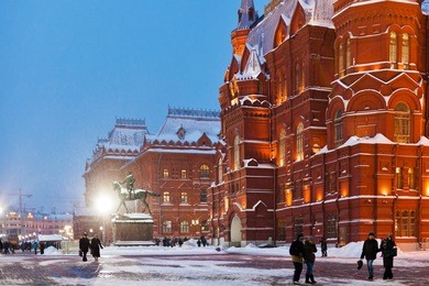 snow in moscow - state historical museum building on manege square in winter evening
