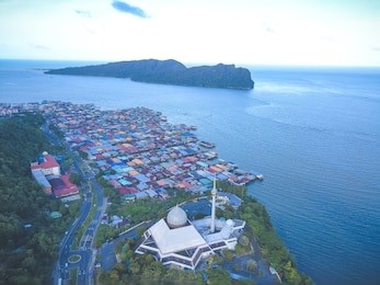 sky view of sandakan city with sandakan district mosque, kg. sim sim water village and berhala island. 