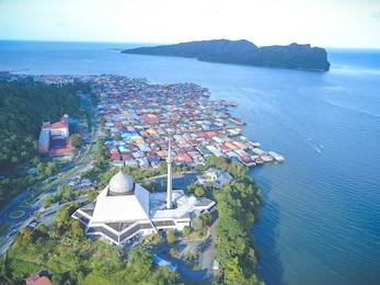 sky view of sandakan city with sandakan district mosque, kg. sim sim water village and berhala island. 