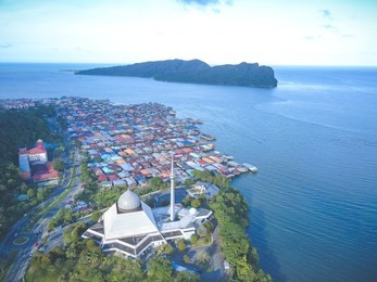 sky view of sandakan city with sandakan district mosque, kg. sim sim water village and berhala island. 