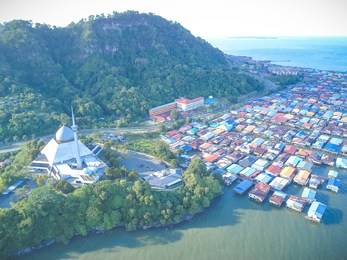 sky view of sandakan city with sandakan district mosque, kg. sim sim water village and berhala island.