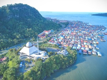 sky view of sandakan city with sandakan district mosque, kg. sim sim water village and berhala island.