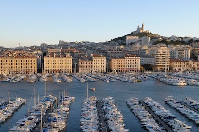 france, provence-alpes-cote d'azur, bouches-du-rhone, marseille. vieux-port with basilique notre dame de la garde on the hill in the background