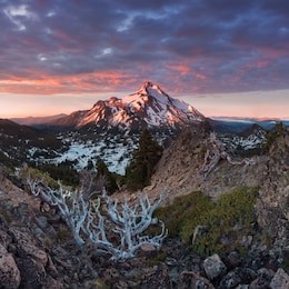 at 10,492 feet high, mt jefferson is oregon's second tallest mountain.mount jefferson wilderness area, oregon
the snow covered central oregon cascade volcano mount jefferson rises above a pine forest