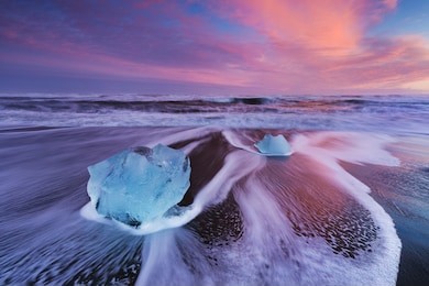 beautiful sunset over famous diamond beach, iceland. this sand lava beach is full of many giant ice gems, placed near glacier lagoon jokulsarlon
ice rock with black sand beach in southeast iceland