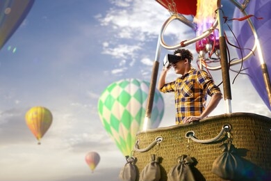 beautiful young man trying vr headset and exploring another world and enjoy