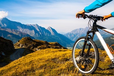 mountain bike wheel and sommer alpine  landscape