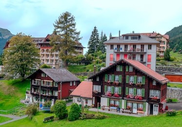 wooden houses in the murren mountains in switzerland on a cloudy day