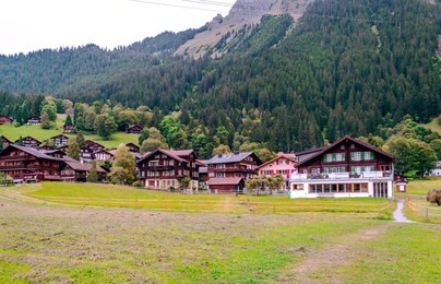 wooden houses in the murren mountains in switzerland on a cloudy day