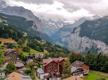 wooden houses in the murren mountains in switzerland on a cloudy day