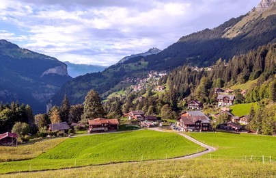 wooden houses in the murren mountains in switzerland on a cloudy day