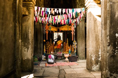 praying monk at ankor wat 