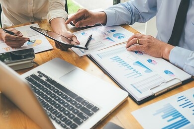 business advisor analyzing financial figures denoting the progress internal revenue service checking document. audit concept