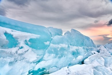     arctic landscape blue ice of the russian far east on the background of a beautiful sunset                           